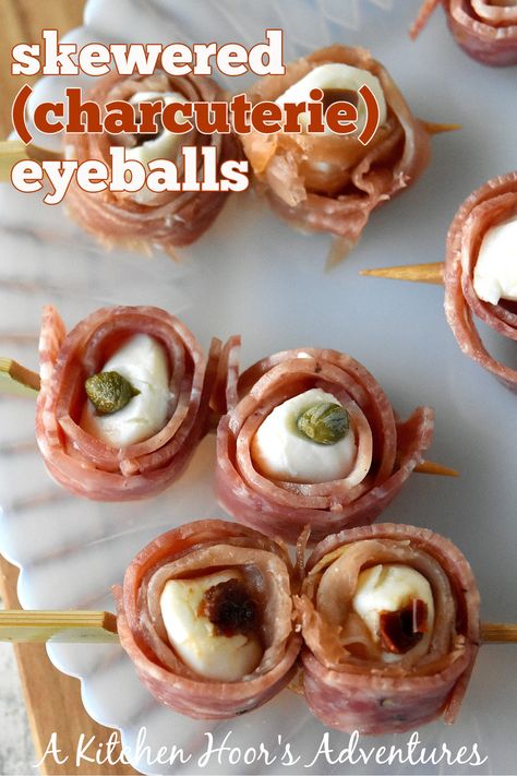 Skewered (Charcuterie) Eyeballs are the perfect centerpiece for your Halloween board! Guaranteed to be the ghostly talk of your Halloween party! ???? #EatDrinkandBeScary #HalloweenTreatsWeek #SpooktacularEats #charcuterie Eyeball Charcuterie, Halloween Skewers Ideas, Charcuterie Eyeballs, Halloween Eyeball Appetizers, Ghost Charcuterie Board, Halloween Skewers, Halloween Charcuterie Board, Halloween Cocktail Party, Charcuterie Meats