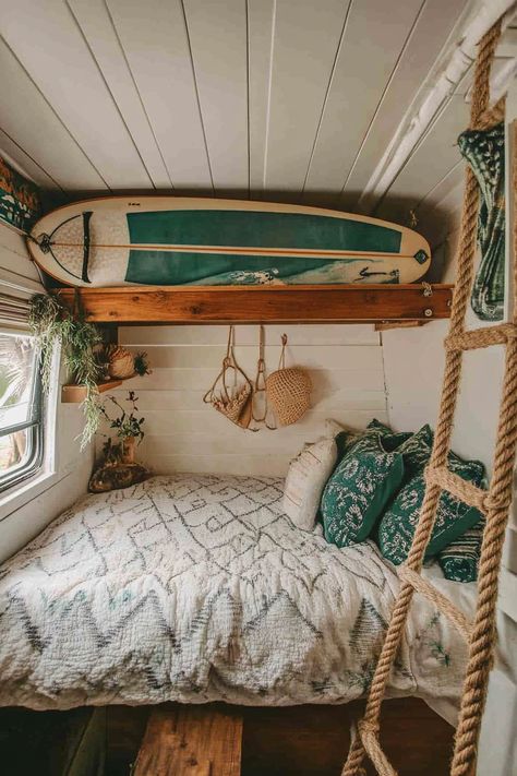 Surf-style van bedroom. Earth tone bedding, wall-mounted surfboard, rope ladder, and white seashell decors.

What if your bedroom could take you right smack to that Californian beach, where the waves gracefully kiss the shore? If you've ever craved that never-ending summer vibe, come aboard, we have wind in our sails. This article is going to serve the coolest 65 surfer van bedroom inspirations that…

Read more: https://tastyinteriors.com/generated-post-65-surfer-van-bedroom-inspirations/ Mounted Surfboard, Earth Tone Bedding, Van Bedroom, Surfer Van, Camper Inspiration, Yurt Living, Surf Van, Rope Ladder, Sea Shell Decor