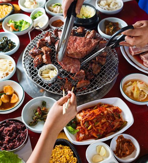 It's Friday night, do you know which Korean Barbecue you're going to!? Korean BBQ is a favorite of TT Editors -- what's not to love about the table crammed with shallow bowls of kimchi and other banchan, marinated meats grilling away mere inches before you, pitchers of never-ending soju and the fact that it's always someone's birthday? #tastingtable #Koreanbarbecue #Koreanfood #Kimchi #noms #foodie #bbq Korea Bbq, Seafood Ramen, Korean Barbecue, Ramen Soup, Propane Grill, K Food, Short Rib, Bbq Restaurant, Korean Dishes