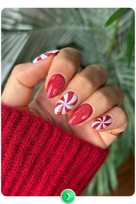 Short red nails with peppermint swirl details, creating a fun and festive Christmas nail design perfect for holiday cheer. Short Almond Christmas Nails Grinch, 2025 Christmas Nails, Christmas Nails Peppermint Swirl, Christmas Nail Ideas Candy Cane, Short Nails Art Christmas, Fun Holiday Nail Designs, Simple Christmas Nails Design, Peppermint Nail Designs, Present Christmas Nails