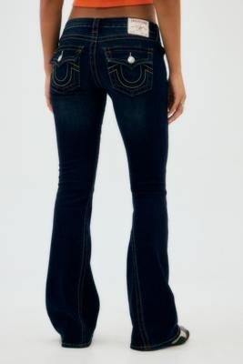 Super flattering True Religion jeans in a 00s slim-fit flare style. Features a low-rise waist, button and zip fastening, belt loops and five-pocket styling. Complete with embroidered horseshoe logos to reverse pockets. Only at UO. **Content + Care** \- 70% Cotton, 26% Polyester, 3% Rayon, 1% Elastane \- Machine wash **Size + Fit** \- Model is 172.5cm/5'8" and wearing size 27W | True Religion UO Exclusive Muddy Waters Joey Flare Jeans - Indigo 30 at Urban Outfitters Low Rise True Religion Jeans, Mexican Girl Outfit, True Religion Outfits, Embroidered Horseshoe, Jeans Website, True Religion Jeans Women, White Goth, Muddy Waters, True Religion Jeans