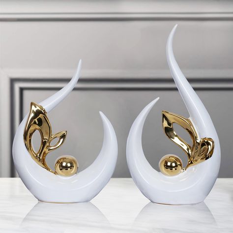 PRICES MAY VARY. Modern Abstract Art Decor size 9.8"H x 5"L x 2.5"W. Small Ceramic Statue 8" high x 6" long x 2.5" wide.Can blend perfectly with most living room decor.Ceramic sculpture can be a perfect art piece for dining room or living room or office decor, coffee table decor [HOME DECOR AESTHETIC]White and Gold Decor made of ceramic material, is an eye-catching piece. After being electroplated and polished, it shows off a mirror-like effect that will never fade [A GIFT EVERYONE LOVES] modern Gold And White Wall Art, Center Peice Decor, Table Centerpieces For Home Modern Gold, Gold White Office Decor, Show Pieces For Living Room, Black White And Gold Home Decor, Flower Centerpieces For Home With Gold Vase, Show Pieces Decor, Show Piece Ideas For Home