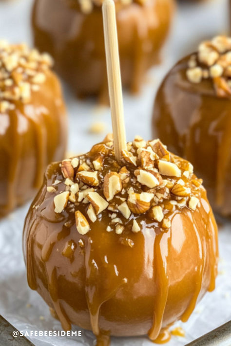 Homemade caramel apples on sticks, each coated in caramel and rolled in chopped nuts for a crunchy, sweet fall treat. *We may earn a small commission from your purchase. Diy Caramel Apples, Apple Container, Diy Caramel, Apple Packaging, Covered Apples, Chocolate Covered Apples, Diy Snacks, Apple Boxes, Creamy Caramel