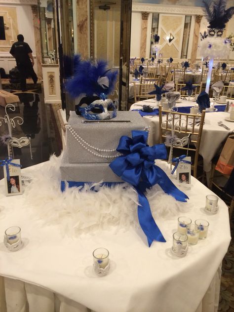 Masquerade theme card box . Royal blue, silver . Feathers with boas . Royal Blue Masquerade Party Decorations, Blue Masquerade Party Decorations, Mascarade Wedding, Masquerade Party Centerpieces, Masquerade Centerpieces, Sweet 15 Ideas, Mascarade Party, Masquerade Party Decorations, Theme Carnaval