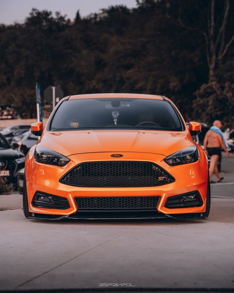 Capturing moments from Stance Adria "t I Ford Focus ST in stunning orange 6 | Let's roll through the memories! # #StanceAdria Owner: @corsigm #FordFocusST #FordPerformance #CarPhotography #AutoEnthusiast #StanceAdria #AutomotiveArt #FordNation #CarLovers #Speedster #DrivePassion #WheelWednesday #DreamRide #AutomotivePhotography Ford St, Ford Rs, Dream Whip, Ford Focus St, Lets Roll, Car Shirts, Capturing Moments, Car Ideas, Automotive Photography