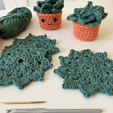 An adorable pattern from Sweaterbabe that is a FREE Ravelry download until November 20! https://www.ravelry.com/patterns/library/358-succulent-coaster-set Coasters are crocheted in the round with a pretty lacy design and are folded to fit in the pot! How cute is this!! The coasters use DK yarn and the pot uses Aran weight, but it could be a good stash busting pattern. What great thank you, teacher or hostess gift! Practical and pretty at the same time! Add this one to your gifting queue! ... Succulent Coaster Crochet, Crochet Coaster Set Free Pattern, Crochet Succulent Coasters, Crochet Succulent, Coaster Crochet, Crochet Coaster, Pattern Library, Crochet Round, Crochet Coasters