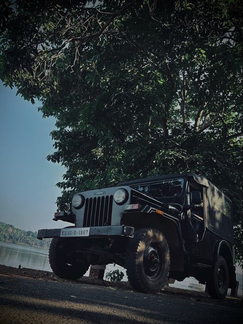 The Nanicheri River can be seen in the background, and the village is located in Kannur, a district in the Indian state of Kerala. And the picture's features a classic Mahindra Jeep. Mahindra Major Jeep, Mahindra Jeep, Kerala, Jeep, Bike, Quick Saves