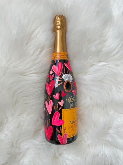 Hen Do House Decorations, Engagement Bottle Decoration, Valentines Aesthetic Decor, Engaged Champagne Bottle, Painted Champagne Bottle Valentines, Champagne Bottle Painting Engagement, Valentines Bottle Ideas, Painted Veuve Bottle Engagement, Painting Ideas For Wedding Gift