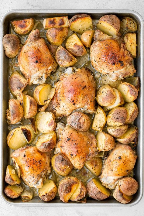 One pan garlic roasted chicken and baby potatoes is an easy to make, delicious, and wholesome meal for the entire family. Prep this sheet pan in 10 minutes. | aheadofthyme.com Garlic Roasted Chicken, Baked Garlic Parmesan Chicken, Easy Fall Dinners, Sheet Pan Meals Chicken, Autumn Recipes Vegetarian, Chicken Shawarma Recipe, Roasted Chicken And Potatoes, Roasted Garlic Chicken, Chicken And Potatoes