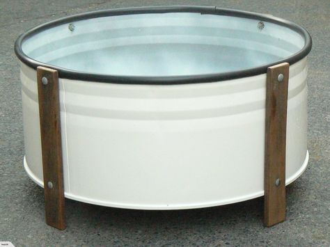 PLANTER BOX: | Trade Me ~ Up-cycled from a steel 44 gallon drum (cleaned and spray painted) and the timber legs were sanded and oiled and attached with galvanised bolts, top rim has a plastic bead to protect from cut edge of drum. Steel Drum Ideas, 44 Gallon Drum Ideas, Oil Drum Ideas, Raised Veg Beds, Vege Garden, 55 Gallon Drum, Grow Herbs, Car Furniture, Diy Workbench