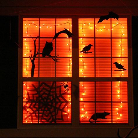 Halloween Window Lights, Halloween Apartment Window Decorations, Halloween Bats On Wall Outdoor, Indoor Halloween Lights, Bay Window Halloween Decor, Halloween String Lights Ideas, Hanging Halloween Lights, Halloween Indoor Lighting, Apartment Window Halloween Decor