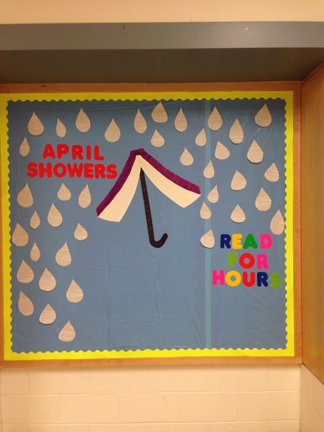 Bulletin board: April Showers, Read For Hours. Raindrops made from book pages. April Showers Read For Hours Bulletin Board, April Showers Bulletin Board, April Library Bulletin Boards, April Library Displays, Media Center Decor, April Bulletin Boards, Book Bulletin Board, School Library Bulletin Boards, Library Assistant