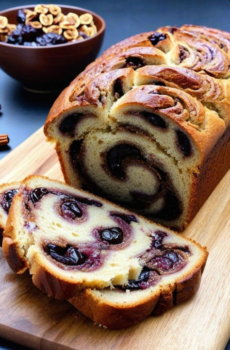 Image of homemade cinnamon swirl raisin bread loaf sliced and ready to serve Low Carb Cinnamon Raisin Bread, Cinnamon Roll Bread Loaf, Cinnamon Raisin Bread Recipe Easy, Raisin Bread Recipes, Cinnamon Raisin Bread Machine, Bread Machine Cinnamon Raisin Bread, Raisin Walnut Bread Recipe, Raisin Quick Bread, Cinnamon Raisin Loaf