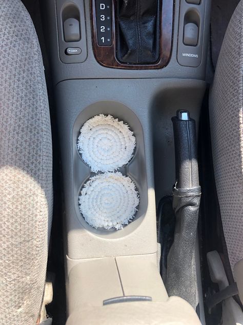 These coasters are super cute for your car cup holder They add a little pop to your car ☺️ Audi Car Decor, Neutral Car Decor, Audi Car Accessories, White Car Interior Decor, Macrame Car Decor, Car Accessories Boho, Tan Interior Car Decor, Macrame Cup Holder, Teen Car Accessories