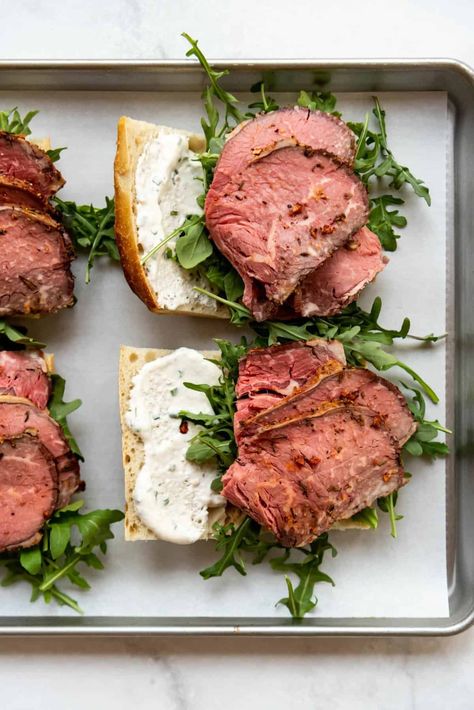 Use up those prime rib leftovers the best way possible by making a thick, satisfying sandwich! We think the best prime rib sandwich is loaded with amazing smoked prime rib, sweet caramelized onions, peppery arugula, and provolone cheese all on a crusty baguette! | leftover prime rib sandwich recipe | leftover prime rib sandwiches recipes | leftover prime rib recipes sandwiches | leftover prime rib recipes ideas | how to use leftover prime rib | how to use up leftover prime rib Prime Rib Roast Sandwich, Amazing Sandwiches Recipes, Prime Rib Dip Sandwich, Prime Rib Leftover Sandwich, Prime Rib Sandwich French Dip, Leftover Prime Rib Sandwich, Leftover Prime Rib Ideas, Prime Rib Sandwiches, Prime Rib Sandwich Recipe