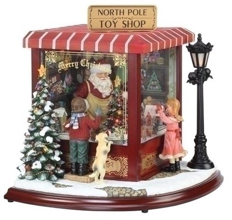 ROMAN 34960 North Pole Toy Shop with LED Lights and Animation - By Roman Coffee Shop Music, Christmas Toy Shop, Santa North Pole, Christmas Music Box, Santa Toys, Christmas Village Display, Christmas Central, Toy Shop, Christmas Villages