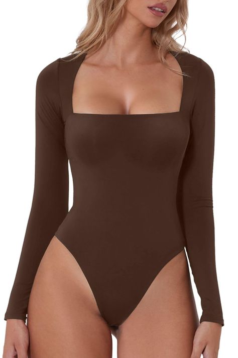 PRICES MAY VARY. Material:Designed in our premium polyamide high-stretch, and breathable fabric that¡¯s dual layered for a compressive fit, can be relied upon to create a flattering silhouette and and wraps itself around your body like a second skin. Feature:the square neck bodysuit features with a square neckline and curved shoulders for a bust flattering fit,Ultra versatile with a high cut, brazilian bottom that can be styled perfectly under jeans and trousers. This sculpting, smoothing square Body Manga Larga, Square Neck Long Sleeve, Bodysuit Designs, Square Neck Bodysuit, Shapewear Bodysuit, Body Suit, Long Sleeve Bodysuit, High Cut, Second Skin