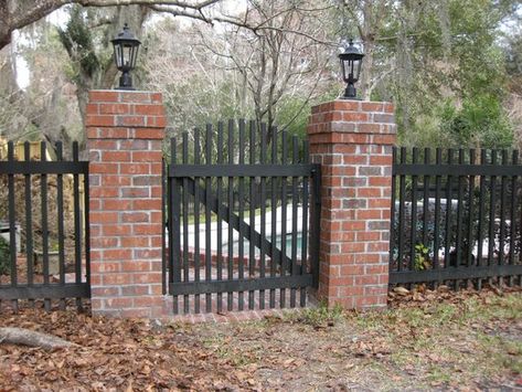 Red brick pillars with charcoal grey iron/or painted pickets Brick Columns Driveway, Brick Gate, Brick Pillars, Garden Gates And Fencing, Brick Columns, Driveway Entrance, Front Fence, Brick Fence, Front Yard Fence