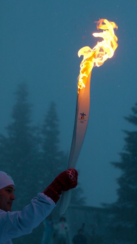 The Olympic Torch burns on at Grouse Mountain during the 2010 Winter Olympic Games in Vancouver, Canada. Olympics Aesthetic Paris 2024, Winter Olympics Aesthetic, Athlete Vision Board, Olympic Games Aesthetic, Olympic Aesthetic, Goals Background, Olympics Aesthetic, Vision Wallpaper, Runner Aesthetic