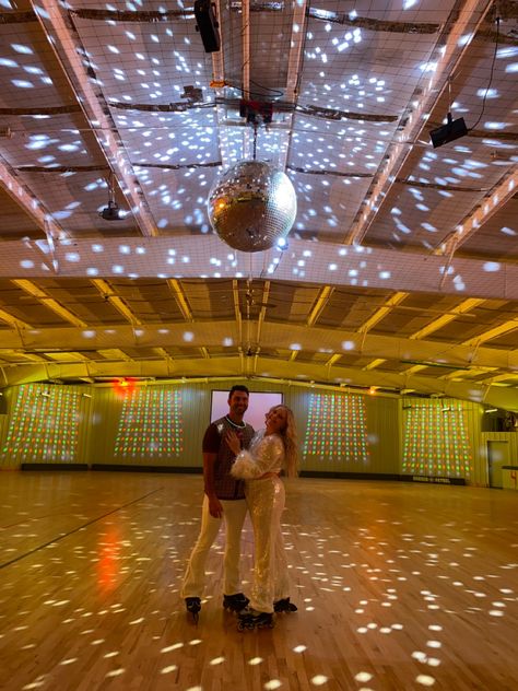 Engaged couple in roller skates under disco ball at roller rink 70s Theme Engagement Party, Roller Rink Wedding Reception, Budget Engagement Party, Disco Engagement Party, Valentines Disco, Roller Disco Party, Unique Engagement Party, Engagement Party Ideas, Roller Rink