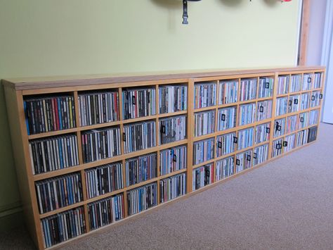 Materials: Billy Bookcase (80x202cm), 6 x Billy CD inserts, 24mm birch faced ply I kept my CD collection in a Billy bookcase for which I’d purchased the CD inserts (I think these are now discontinued). I’ve redecorated my home office and didn’t want the tall bookcase; I wanted to hang guitars on the wall, and this [&hellip Ikea Cd Storage, Painting Particle Board Furniture, Billy Regal Hack, Vhs Storage, Lp Regal, Cd Shelves, Billy Ikea, Billy Bookcases, Dvd Shelves