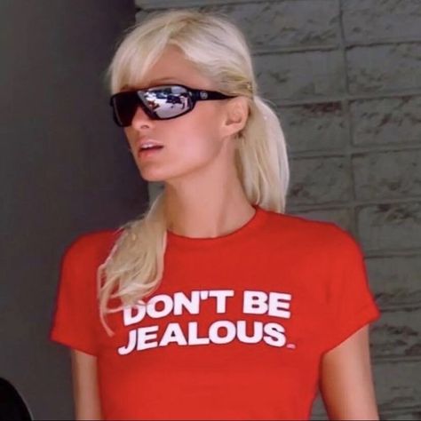 "I am not pretty sure that Paris Hilton's 2000's iconic slogan tees speaks louder than her attitudes. But at least they can race, don't they? This icon red shirt is a great answer for those who get  jealous of you. So this red women's tee could be a best option for a party.   About The unisex soft-style t-shirt puts a new spin on casual comfort. Made from very soft materials, this tee is 100% cotton for solid colors. Heather colors and sports grey include polyester. The shoulders have twill tape for improved durability. There are no side seams. The collar is made with ribbed knitting to prevent curling damage.  Fabric 💄100% ring-spun cotton (fiber content may vary for different colors) 💄Light fabric (4.5 oz/yd² (153 g/m 💄Eurofit 💄Tear-away label 💄Runs true to size Key features Without Don’t Be Jealous Paris Hilton, Dont Be Jealous Paris Hilton, Paris Hilton Dont Be Jealous, Stop Being Jealous Paris Hilton, Paris Hilton Shirts, Iconic Tshirt Quotes, Iconic Shirts Quotes, Dont Be Jealous, Iconic Shirts