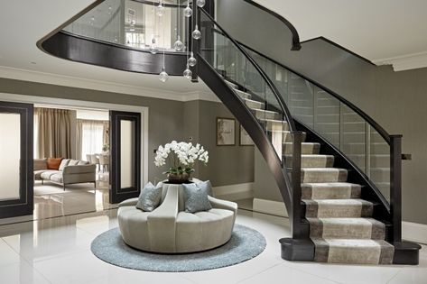 The bespoke seating arrangement in centre of the hall is both practical and enticing. Entrance Seating, Luxury Hallway Entrance, Modern Entrance Hall Decor, Luxury Houses Entrance, Luxury Staircase, Stairs Design Interior, House Staircase, Modern Entrance, Interior Design Gallery