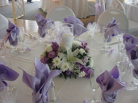 purple low centerpiece w/candle Purple Candle Centerpieces, Romantic Wedding Flowers Centerpieces, Floral Candle Centerpieces, Wedding Table Centerpieces Purple, Purple Wedding Tables, Purple Wedding Centerpieces, Purple Wedding Decorations, Purple Centerpieces, Wedding Party Centerpieces