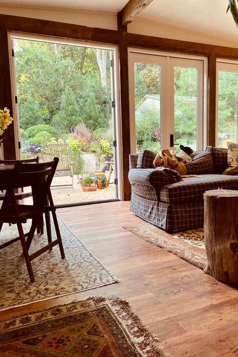 Check out this rustic sunroom that showcases a cabin-like design, using COREtec Carolina Pine Vinyl Flooring. This flooring is 100% waterproof, perfect for a sunroom. The warm tones in this space truly represent a rustic and cozy feel. Coretec Carolina Pine, Sunroom Floor, Rustic Sunroom, Boho Sunroom, Staining Wood Floors, Cozy Sunroom, Lake Ideas, Pine Walls, Dream Beach Houses