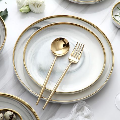 Have a good time with your families and friends and enjoy good food with these distinct 18-piece dinnerware sets. Gold rim design and delicate marble pattern are a great combination for adding exquisite modern appeal to your tablescape. It includes dinner plates, bowls, spoons, and so on. Crafted from premium ceramic, it allows a timeless look and beauty. Modern Dining Plate Set, Dinner Sets Dinnerware Tableware, Dining Table Plate Set Up, Kitchen Bowls Set, Elegant Plates Sets, White And Gold Dinnerware, Dinner Service Set, Spoon Design Ideas, Modern Kitchen Plates