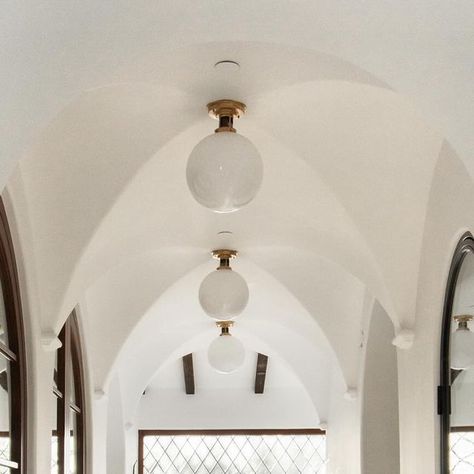 Dagan Design & Construction Inc / Dagan Koffler on Instagram: "When the light hits just right… We love the way this hallway space gets flooded with natural light through the diamond grille window and love the drama of all the curves and groin vault architecture, along with the quaint and magical seating area that we think would make the perfect reading nook. From our completed Rancho Santa Fe project done with @alexisgarrettdesign #naturallighting #naturallight #spanishrevival #groinvault Hallway Architecture, Vault Architecture, Arches Architecture, End Of Hallway, Converted Garage, Hallway Design, Spanish Revival, The Drama, Custom Lighting