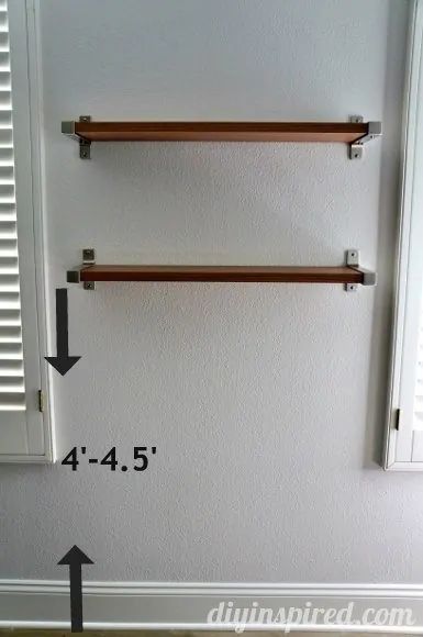 The Right Height to Hang Shelves - DIY Inspired How High To Hang Shelf Above Toilet, Shelf Placement Ideas, Shelves Above Desk, Shelf Placement, Hang Shelves, Shelves Above Toilet, High Shelf, Hallway Walls, Shelves Diy