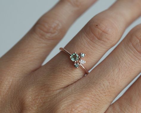 Pretty little cluster ring, a green tourmaline ring with a 4mm round mint tourmaline as the center stone, and a pear white diamond, round blue diamond and round green sapphire as side stones. A special and unique mini engagement, anniversary or wedding cluster ring can also be a perfect modern October birthstone ring. The design can be made with gemstones of your choosing. If you would prefer a custom ring, please contact us before purchase. Please take a look at a larger tourmaline cluster ring Aquamarine Engagement Ring Vintage, Tourmaline Engagement Ring, Green Tourmaline Ring, Marquise Shape Diamond, Unique Engagement Ring, Engagement Ring White Gold, Cluster Engagement Ring, Ring Rose Gold, Tourmaline Ring