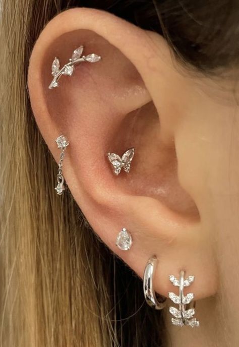 Ear Piercing Ideas Flat Cartilage, Ear Pirsing Ideas Women, Ear Piercing Ideas Helix Simple, Butterfly Ear Piercing, Silver Ear Styling, Percing Conch, Eat Piercing Placement Ideas, Different Ear Piercings Ideas, Peircings Women Ear