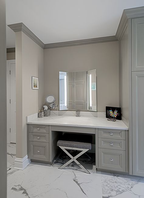 Custom built-in make-up vanity in master bathroom has stained gray cabinetry and quartz countertop. Designed and Built by Benvenuti and Stein for Winnetka home. #makeupvanity #graybathroom #customvanity #custombathroom Get Ready Vanity In Bathroom, Bathrooms With Vanity Area, Built In Make Up Table, Makeup Table In Bathroom, Custom Vanity Bathroom Makeup, Built In Makeup Table, Build In Vanity Bedroom, Bathroom Towel Storage Cabinets, Makeup Vanity For Bathroom