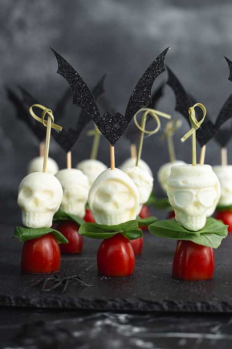 Caprese Skull Skewers | Gluten Free & More Skeleton Caprese Salad, Halloween Caprese Salad, Skull Strawberries, Halloween Caprese Skewers, Halloween Antipasto Skewers, Mozzarella Skulls, Skull Caprese Skewers, Halloween Caprese Eyeballs, Tortellini Mozzarella Tomato Skewers