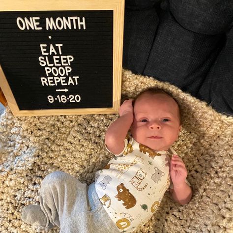 One month baby photo. Photo board says Eat, Sleep, Poop, Repeat. Infant laying on blanket next to sign. Newborn One Month Quotes, One Month Old Milestones Photo Ideas, One Month Old Photoshoot At Home, 1st Month Photoshoot Ideas At Home, One Month Milestones Baby Photos, Baby Boy Monthly Milestone Ideas, Boy 1 Month Photo Ideas, 1 Month Picture Ideas, 1 Month Newborn Photo Ideas