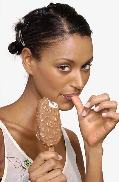 5,518 Woman Eating Ice Cream Photos and Premium High Res Pictures - Getty Images Eating Parfait Pose, Eating Dango Pose, Eating Ice Cream Pose Reference, Person Eating Popsicle Reference, Chocolate Eating Poses, Eating Ice Cream Pose Drawing, Ice Cream Pose Reference, Eating Popsicle Pose, Eating Ice Cream Pictures