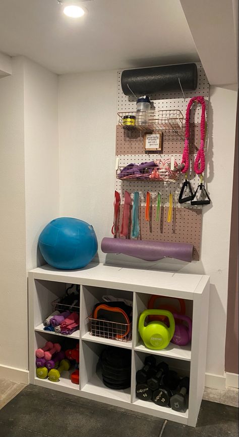 I ordered the shelves and baskets from Walmart - the peg board from Home Depot Peg Board Home Gym, At Home Gym Organization, Basement Office Workout Room, Fitness Storage Ideas, Garage Peloton Set Up, Home Gym And Den Combo, Ikea Home Gym Hacks, Small Workout Corner Ideas, Purple Home Gym Workout Rooms