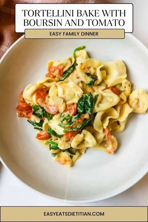 This easy tortellini bake is an upgrade from your standard baked tortellini recipe. Bake herby Boursin cheese with cherry tomatoes, then toss in fresh spinach and tortellini for hot, delicious comfort food. #tortellinibake #bakedtortellini #easydinner #weeknightdinner #fallrecipes #winterrecipes #comfortfood #easydinnerideas Easy Tortellini Bake, Easy Carrot Souffle Recipe, Spinach And Tortellini, Baked Tortellini Recipes, Boursin Pasta Recipe, Hearty Pasta Recipes, Boursin Recipes, Easy Tortellini, Baked Tortellini