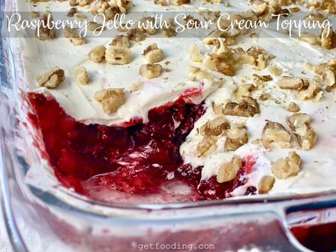 A family recipe, raspberry jello with sour cream topping is absolutely divine! Chunks of raspberries and pineapple, with a sour cream cheese frosting. Yum! #jello #raspberries #berries #sourcream #dessert #sidedish #treat #yummy #food #baking Cranberry Jello Salad With Cream Cheese Topping, Cranberry Jello Salad With Cream Cheese, Cranberry Salad Recipes With Jello, Thanksgiving Jello Salad, Cranberry Jello Salad Recipe, Desserts With Cream, Desserts With Cream Cheese, Raspberry Jello Salad, Cranberry Recipes Dessert