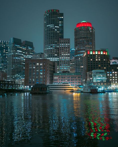 View of the Boston skyline at night from Fan Pier Park, Boston, Massachusetts Boston Park, Boston Travel Poster, Boston Skyline Painting, Boston Massachusetts Photography, Boston Scenery, Boston Public Transportation, Boston Skyline, Rail Transport, Boston Massachusetts