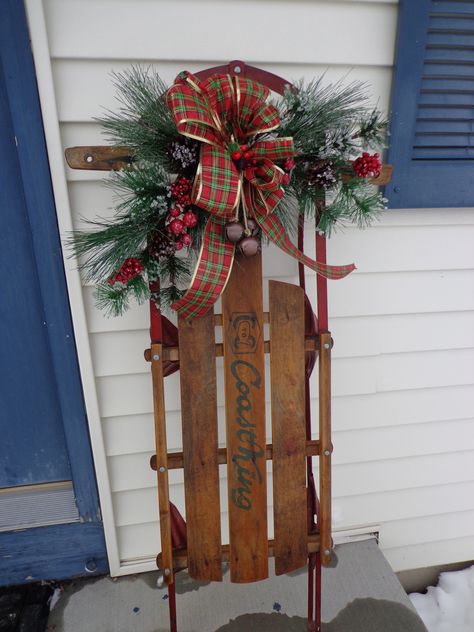 Our childhood sled that my sister had the foresight to save.  She was gracious enough to let me repurpose it for a very special Christmas decoration. Christmas Sled Decoration, Sled Decor, Wooden Sled, Christmas Sled, Christmas Porch Decor, Christmas Sleigh, Christmas Porch, Vintage Christmas Decorations, Snowboards