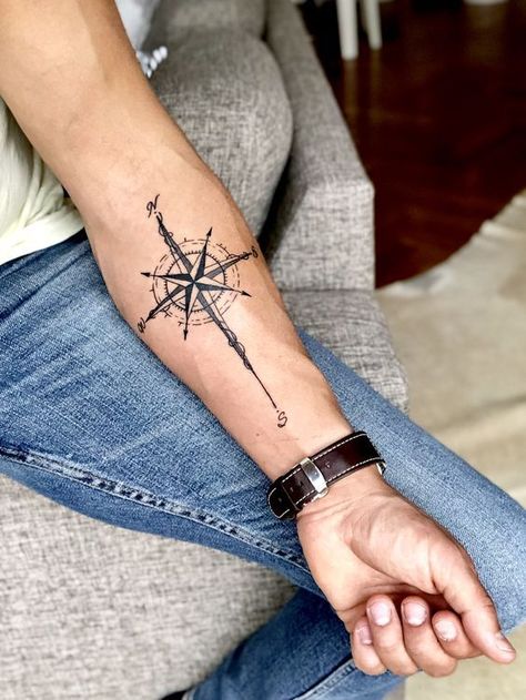 Trendsetting Compass Tattoos for Men: Nautical Designs & Symbolism Compass Tattoos Arm, Compass Tattoo Ideas, Arrow Compass Tattoo, North Star Tattoos, Nautical Compass Tattoo, Compass Tattoo Men, Tatuagem Masculina Pequena, Compass Tattoo Design, Star Tattoo Designs