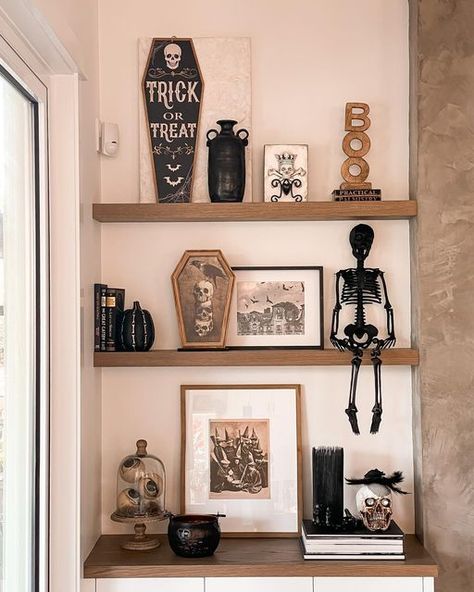 Halloween Home Inspiration, Fall Halloween Shelf Decor, Halloween Shelf Decor Living Room, Halloween Decor Floating Shelves, Shelf Decor Halloween, Spooky Bookshelf Decor, Halloween Book Shelf Decor, Halloween Wall Shelf Decor, Halloween Built In Shelves Decor