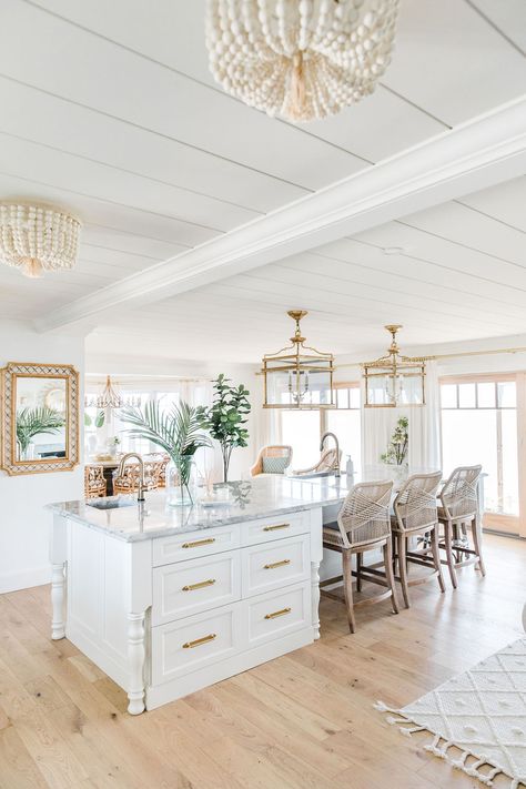 How to Add Coastal Chic Style to Your Home - The Leslie Style Coastal Layered Rugs, Chic Beach House Coastal, Coastal Open Floor Plan, Coastal Laminate Flooring, Coastal Chic Design, Grand Millennial House Exterior, Coastal House Flooring, Coastal Modern Beach House, Coastal Great Room Ideas