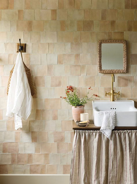 Pale clay or terracotta tones are perfect for creating interior schemes with a neutral but eye-catching feel. This bathroom used our Barnfield glazed wall tiles in both the rectangle and square for a modular look. The Sand option used here has a lovely wide variation of warm tones, and could be equally effective as a kitchen splashback. The basin is our Spitalfields small basin, with Bournbrook basin mono tap. Terracotta Bathroom Walls, Cream Tile Bathroom, Bathroom Tiles Combination, Wall Paint Inspiration, 1930s House Interior, Cream Tile, Kitchen Splashback Tiles, Tile Splashback, Glazed Walls