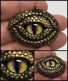 Black and gold dragon eye pendant | Made of black polymer cl… | Flickr Black And Gold Dragon, Polymer Clay Kunst, Black Polymer Clay, Dragon Eyes, Dragon Eggs, Polymer Clay Dragon, Dragon Crafts, Clay Dragon, Rock Painting Patterns