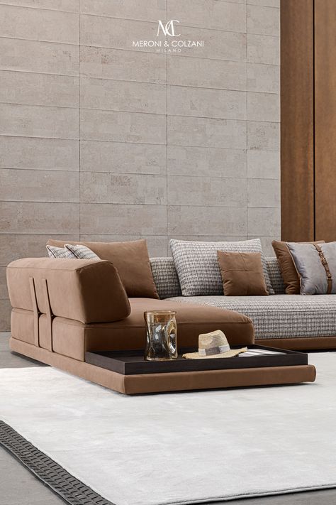 The Mediterraneo sofa comprises a leather base, a soft seat and a rounded structure that acts as a backrest and armrest. The sofa features leather-covered metal designer elements that support the entire structure while lending it a distinctive character. The Mediterraneo sofa is available in a variety of finishes and sizes, and also features modules with a built-in side table. Be amazed by the combination of materials and colours of its finishes.    Design: Cesare Arosio Built In Sofas, Italy Living Room, Italy Living, Projects For Home, Built In Sofa, Sofa Seating, Sofa Seats, Flagship Store, Dining Room Bedroom