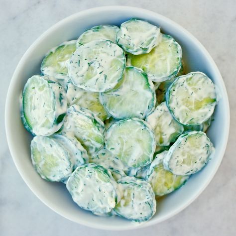 This is the easiest and most refreshing summer salad you will ever make. A tzatziki style dressing gives it that extra punch. Barbecue Sides, Salad Recipes Healthy Easy, Creamy Cucumber Salad, Resep Salad, Creamy Cucumbers, Salad Recipes For Dinner, Mediterranean Diet Recipes, Chicken Salad Recipes, Food For A Crowd